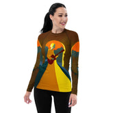 SurArt 81 Women's Rash Guard worn by a woman surfing in the ocean